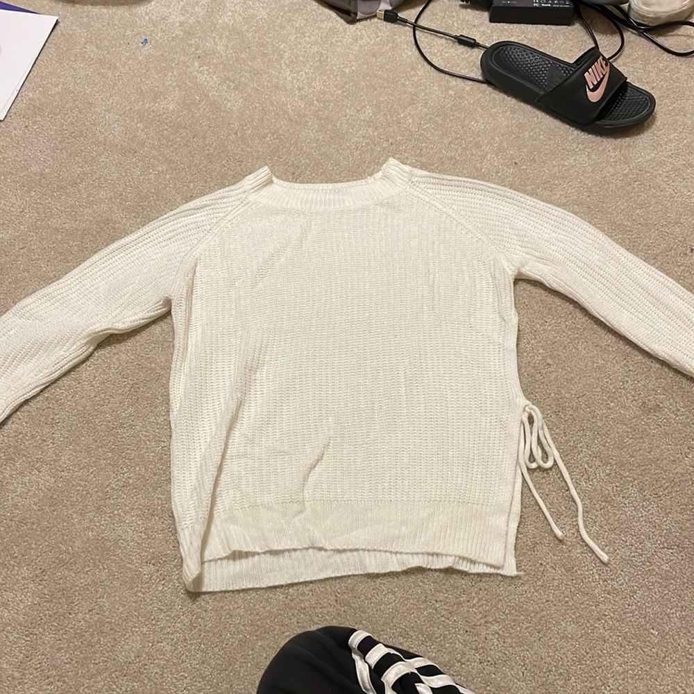 Sweater with tied slit on the side
